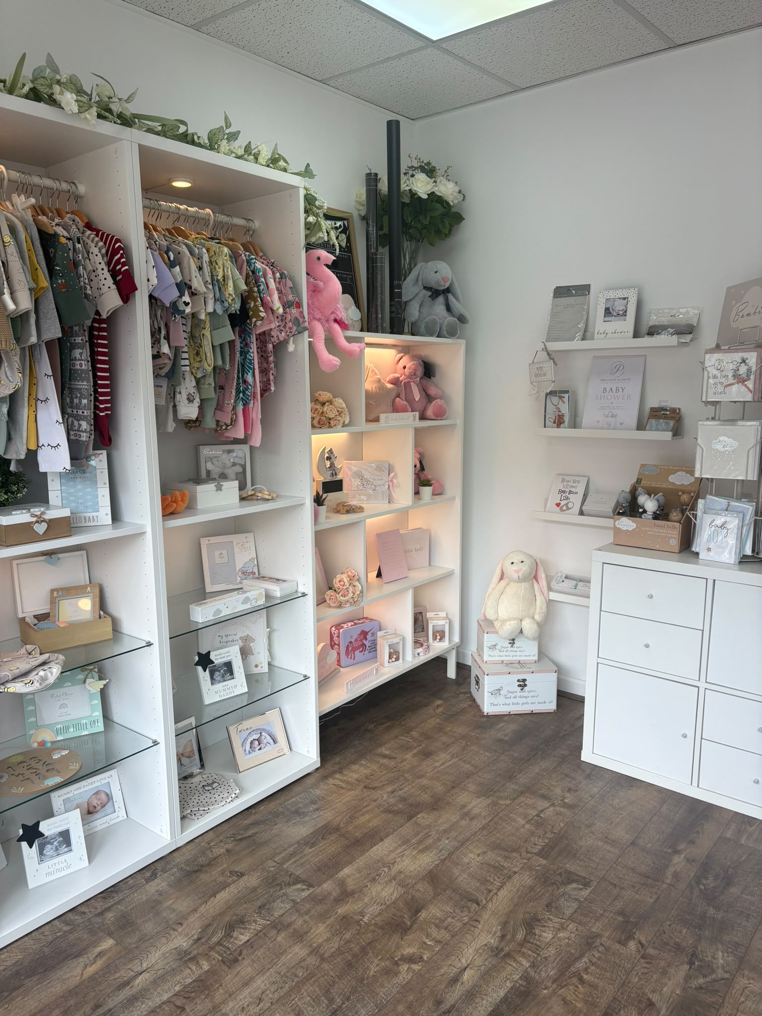 The boutique at Precious Glimpse, with rails of baby clothing and shelves of keepsakes