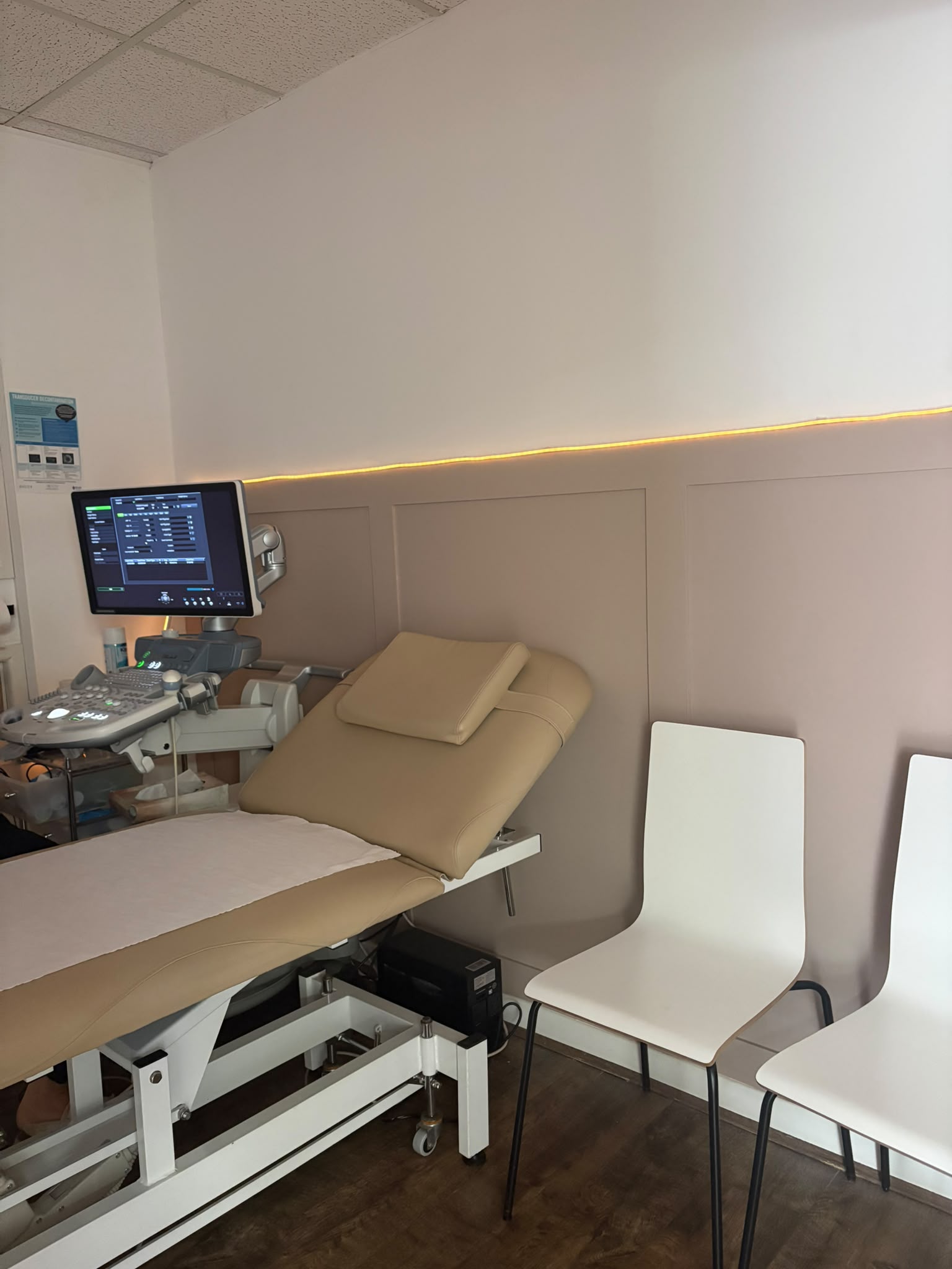 A scan room at Precious Glimpse, with the ultrasound machine, scan couch and seating for guests